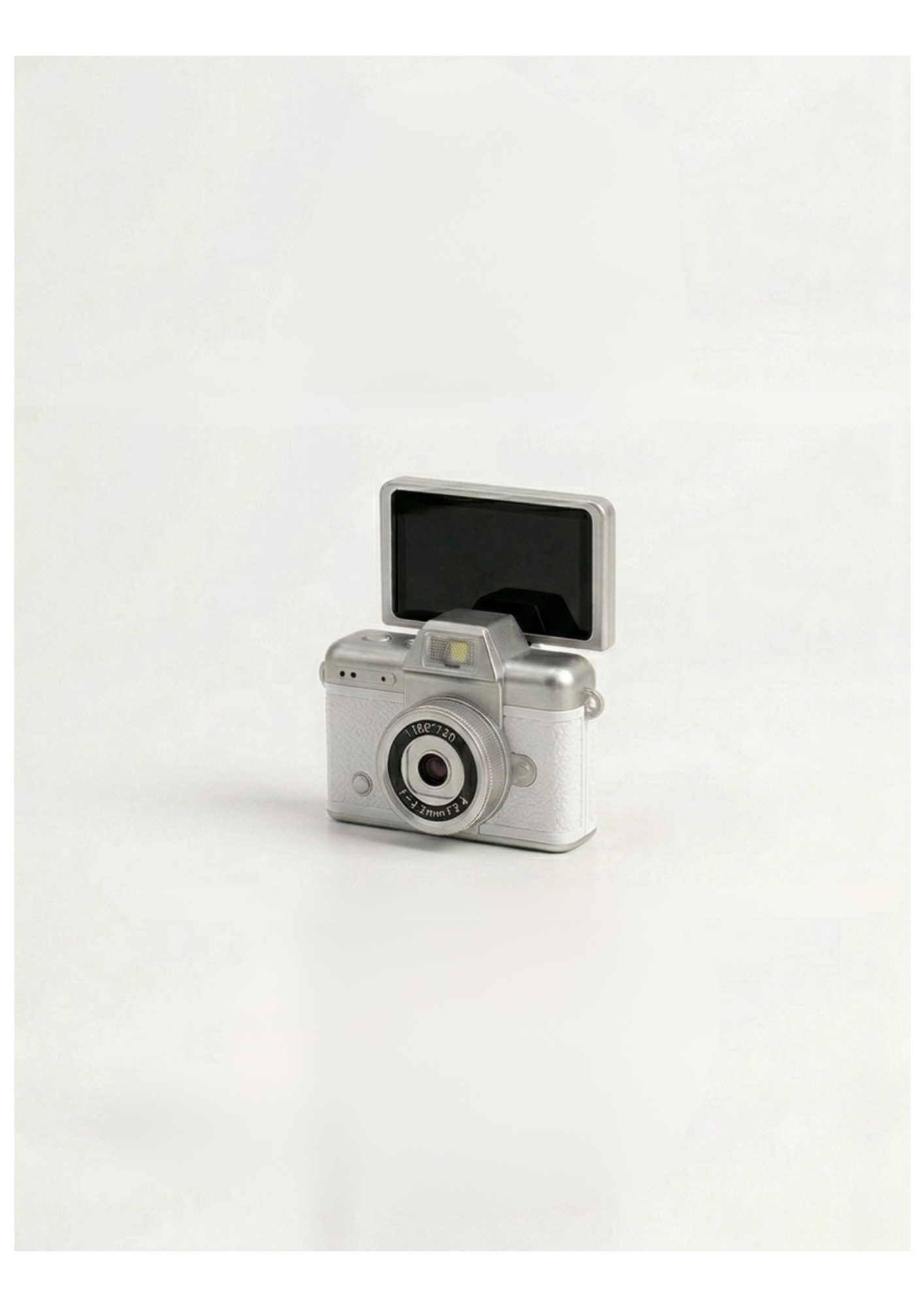 Mini cámara vintage blanca con pantalla abiert